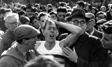 Roger Bannister in a crowd after his record-breaking run