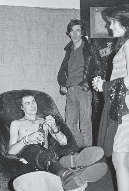 Two men and woman in black and white image
