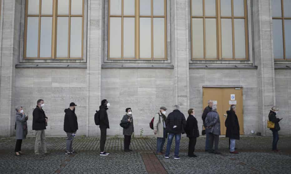 People line up for vaccination injections at the Malteser relief service on the fair grounds in Berlin, Germany.