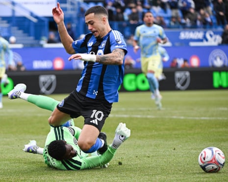 CF Montreal's Ivan Jaime leaps over Philadelphia Union goalkeeper Andre Blake during MLS match.