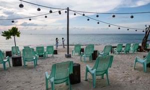 Empty seats in front of bar on a quiet beach on Koh Phangan in Thailand.