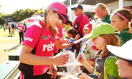 Perry signs autographs for fans after the Sydney Sixers’ first Women’s Big Bash League match on 6 December in Sydney.