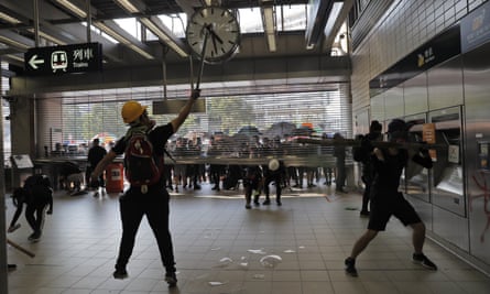 Anti-government protesters vandalise an MTR public transport station in Hong Kong.