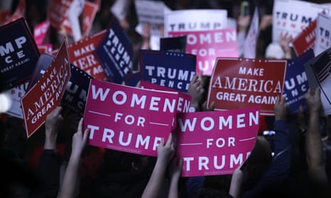 Supporters hold ‘Women for Trump’ signs before a campaign rally for the presidential candidate on 7 November 2016, in Manchester, New Hampshire.