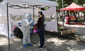 A healthcare worker administers a coronavirus test at the Lazaro Cardenas Park in Mexico City, Mexico 24 July 2020.