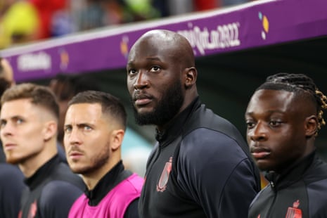 Romelu Lukaku watches from the bench as Belgium work hard in the first half.