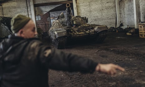 Ukrainian army mechanics repair tanks at a hangar in Kharkiv Oblast, Ukraine on March 18, 2023. (Photo by Diego Herrera Carcedo/Anadolu Agency via Getty Images)