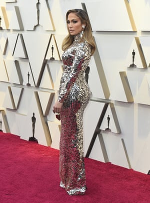 Jennifer Lopez returned to the Oscars for the first time since 2015 to present an award, and wore a playful form-fitting, long-sleeved mosaic dress in silver by Tom Ford. It drew comparisons to a disco ball despite encompassing a host of red carpet trends: metallics, high necks and slicked down hair