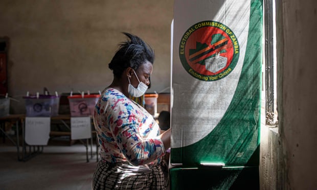 A woman fills her ballot at a polling station in Lusaka.
