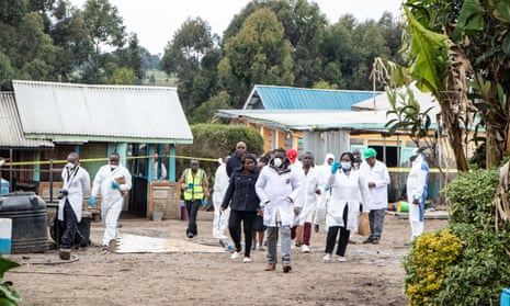 Officals secure the scene after the fatal fire at Hillside Endarasha academy in Nyeri, central Kenya.