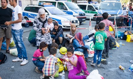 People who have been detained by police gather in a holding area at Munich main railway station.