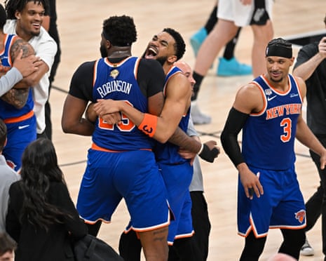The New York Knicks celebrate after clinching the NBA title