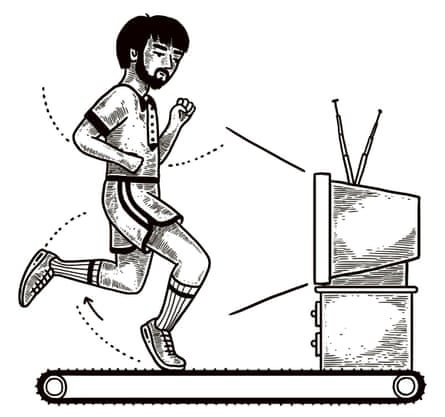 a man watching TV while running on a treadmill