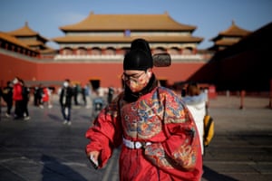 A man wearing Chinese traditional clothes and protective face mask on the way to visit the Forbidden City during the 2021 New Year holidays, in Beijing, China, 01 January 2021.