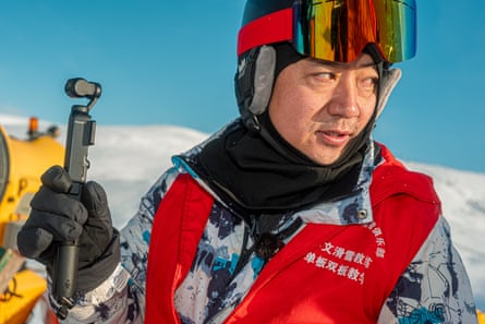 Closeup of skier with non-Latin script on jacket