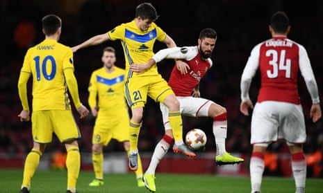 An early tussle between Arsenal’s Olivier Giroudand BATE Borisov’s Stanislav Dragun.