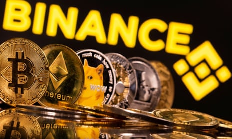 Representations of cryptocurrencies Bitcoin, Ethereum, DogeCoin, Ripple, and Litecoin are seen in front of a displayed Binance logo