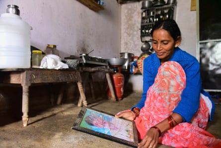 Latha Bollapally, holds a picture of her husband, Madhu Bollapally, 43, who died suddenly in Qatar of ‘natural causes’.