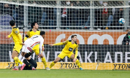 Augsburg’s Noah Sarenren Bazee scores his side’s equaliser in the draw with Broussia Dortmund