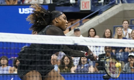 Serena Williams returns very close to the net.
