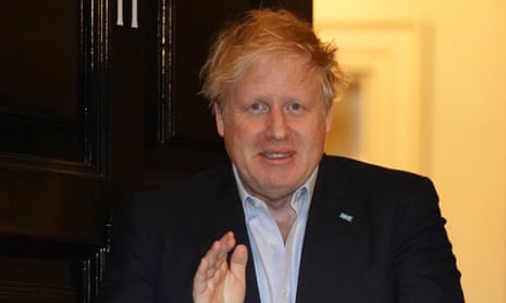 Boris Johnson seen clapping for carers before his admission to hospital.