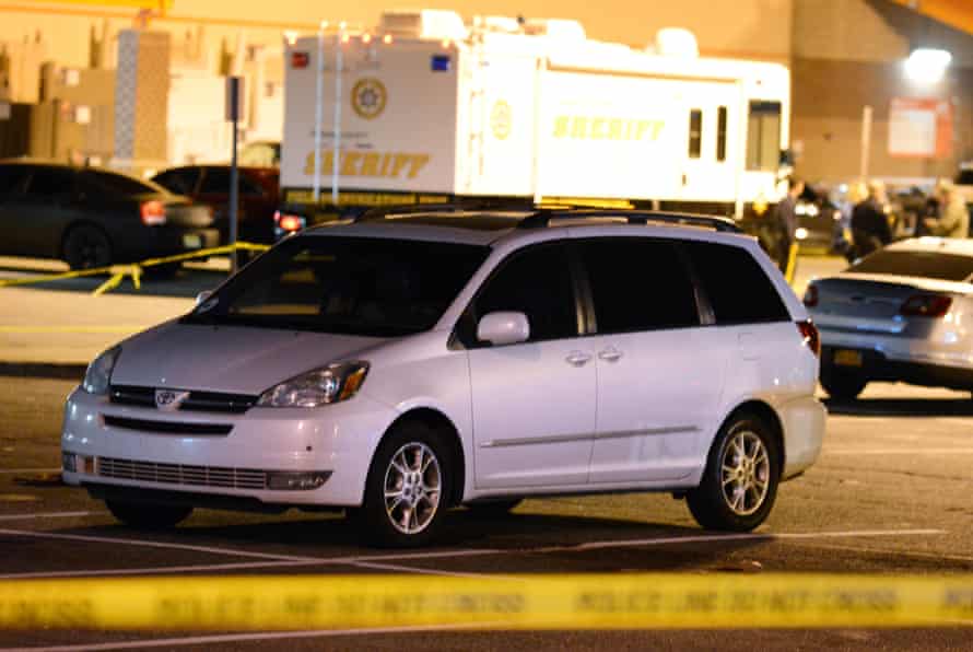 A minivan is taped off by police at a parking lot of a Home Depot in Passaic New Jersey.
