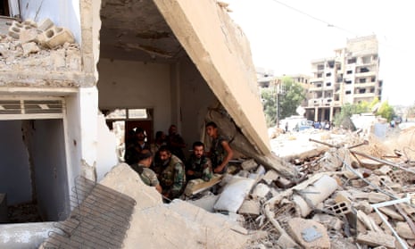 Soldiers in the besieged town of Daraya