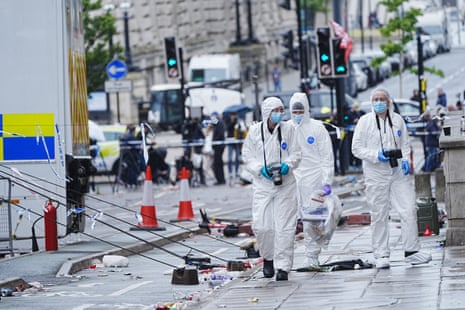 Forensic officers at the scene in Water Street near the Liver Building in Liverpool