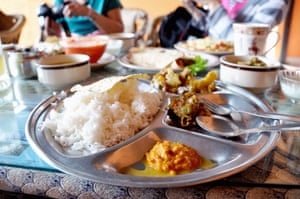Dal Bhat, traditional Nepali meal platter with rice, lentils soup, vegetables, poppadum and spices.