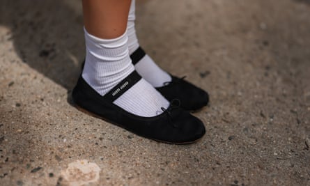 Emili Sindlev is seen wearing white socks and black Miu Miu ballerinas at New York fashion week.