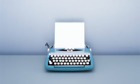 Sheet of blank paper in Typewriter on desk
