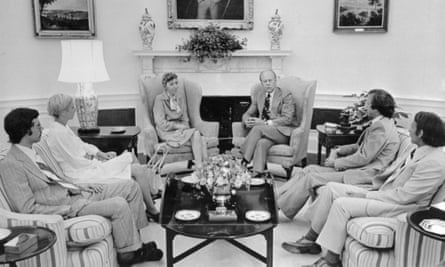 President Ford (centre right) in the Oval Office with the Olson family.