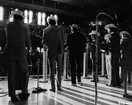 Marty Stuart performing with Lester Flatt and band at the Ryman Auditorium in 1973.