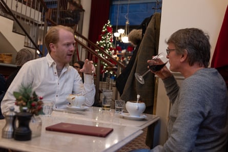 Rupert and Paul chatting over a restaurant table