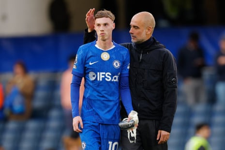 Cole Palmer and Pep Guardiola after the match.