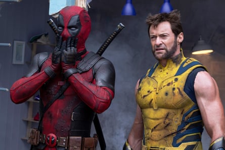 Reynolds with Hugh Jackman as Wolverine.