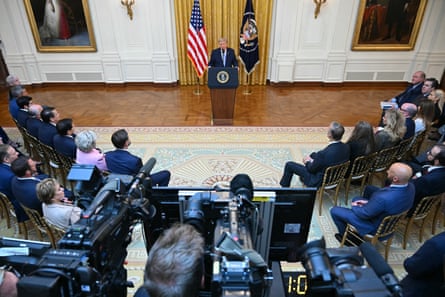 a man in front of cameras