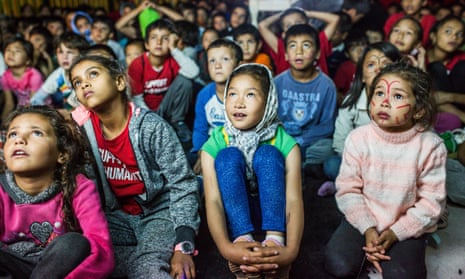 Children watch a cartoon at the Moria camp in Lesbos
