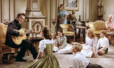 Plummer, left, with Julie Andrews (standing) in The Sound of Music.