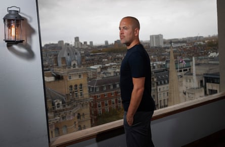 Joe Cole looks out the window at the Treehouse Hotel.