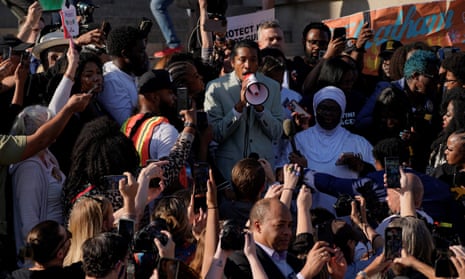 crowd around man with megaphone