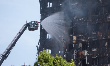 Grenfell Tower smoulders after a fire ripped through the building in west London.