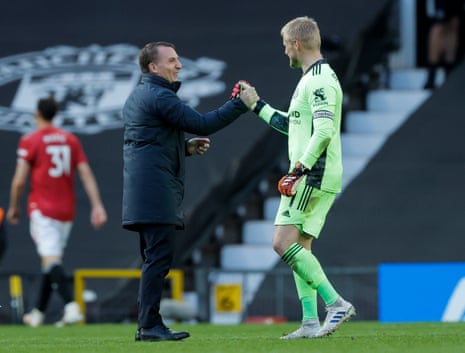 Leicester City manager Brendan Rogers celebrates the Foxes’ win with keeper Kasper Schmeichel.