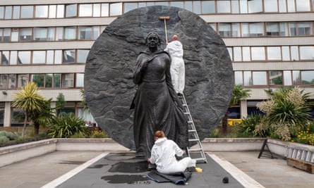 Cleaners work on the statue of Mary Seacole outside St Thomas’s hospital in London.