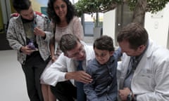 Ashya King (second from right) with doctors at the proton therapy centre in Prague in September.