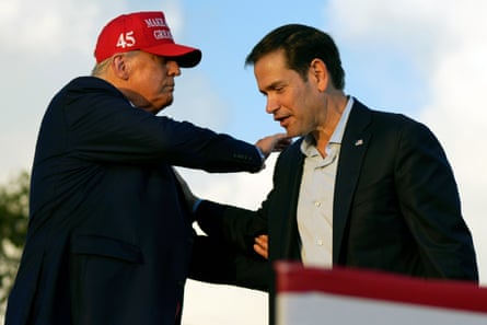 a man patting another man shoulder