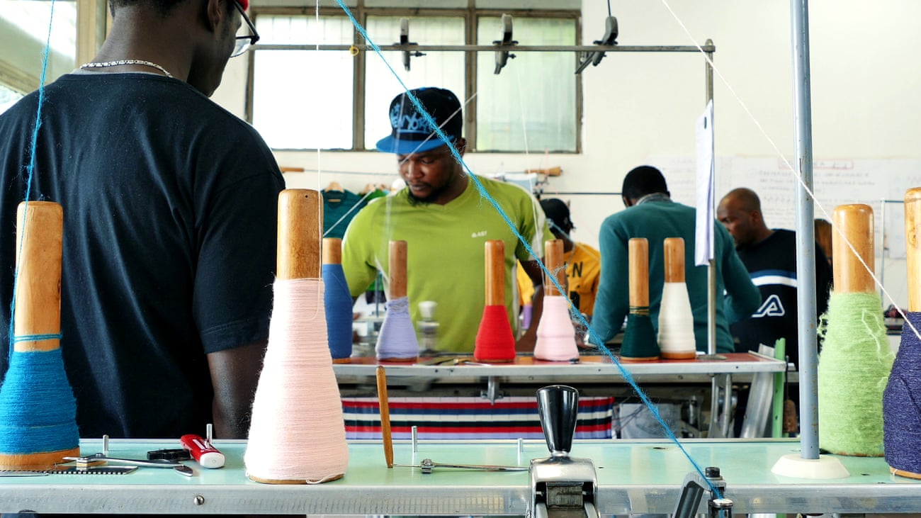 Workers training on knitting at the Manusa co-operative in Pistoia, Italy, which supports and teaches vulnerable people