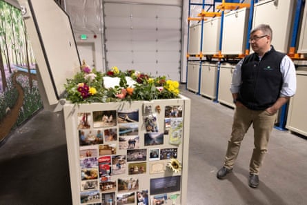 US-DEATH-ENVIRONMENT-RETURN HOMEReturn Home CEO Micah Truman shows a demonstration “vessel” for the deceased, which has been decorated by Return Home with flowers and family photos, during a tour of the funeral home which specializes in human composting in Auburn, Washington on March 14, 2022. - Washington in 2019 became the first in the United States to make it a legal alternative to cremation. (Photo by Jason Redmond / AFP) (Photo by JASON REDMOND/AFP via Getty Images)