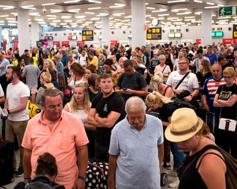 Thomas Cook passengers queue at Son Sant Joan airport in Palma de Mallorca
