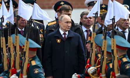 Vladimir Putin attends a wreath-laying ceremony at the Tomb of the Unknown Soldier after the Victory Day military parade in Moscow